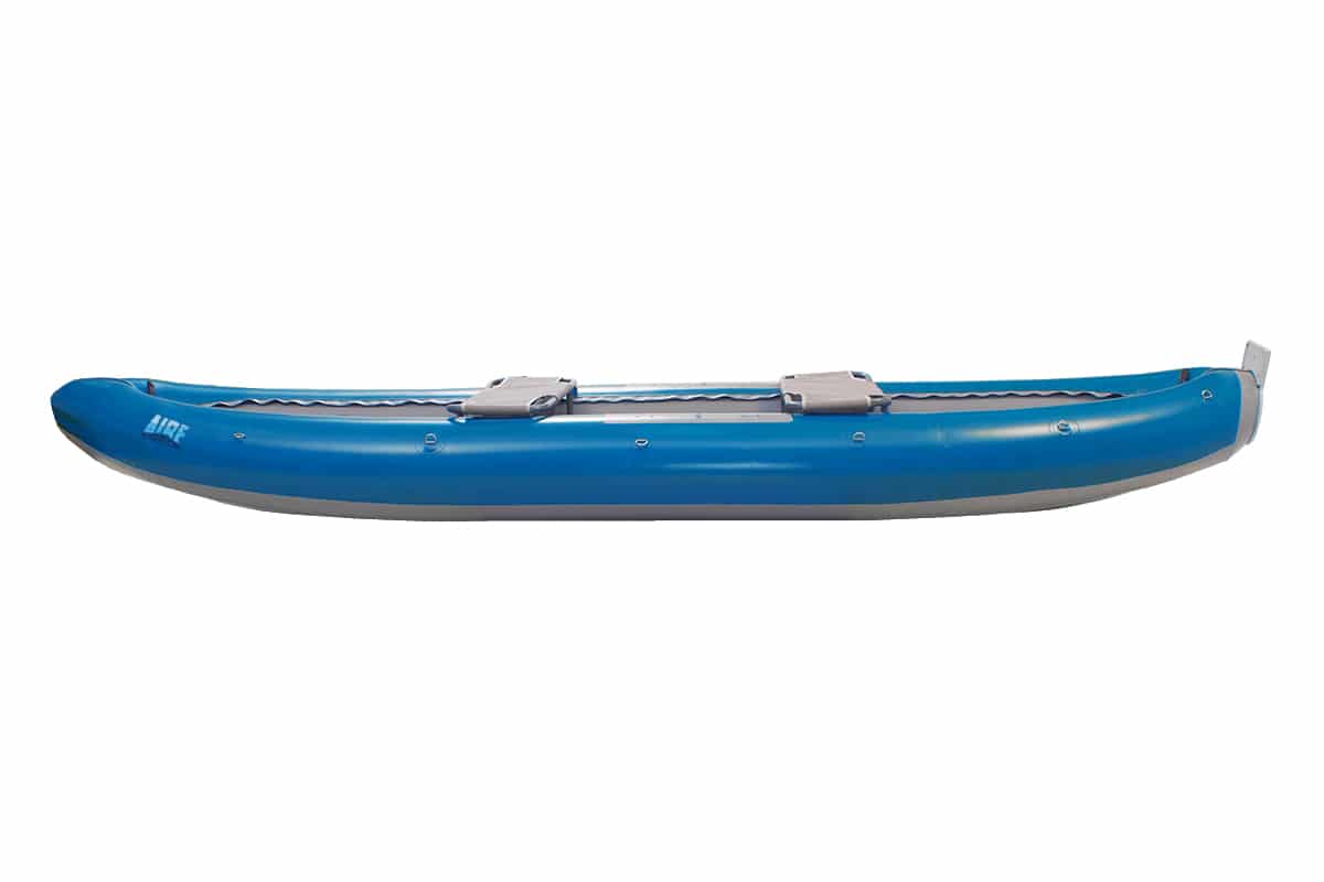 Blue canoe on neutral background, showcasing sleek design for recreational paddling.